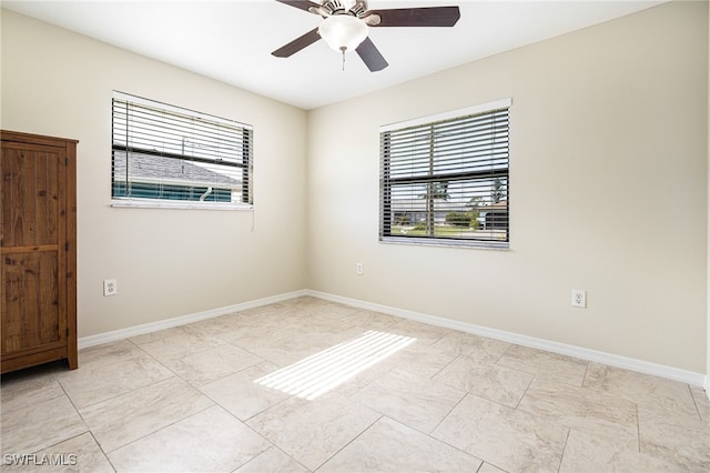 unfurnished room with ceiling fan