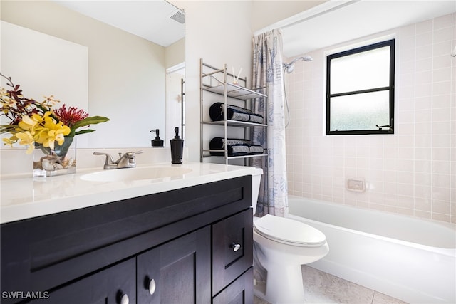 full bathroom featuring vanity, shower / bath combination with curtain, toilet, and tile patterned floors