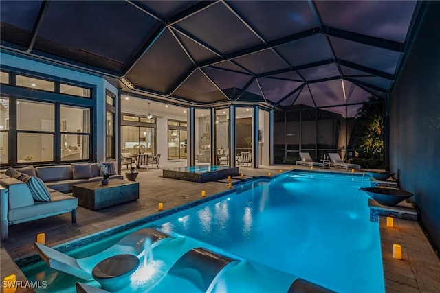 view of swimming pool featuring a patio, an in ground hot tub, pool water feature, an outdoor hangout area, and a lanai