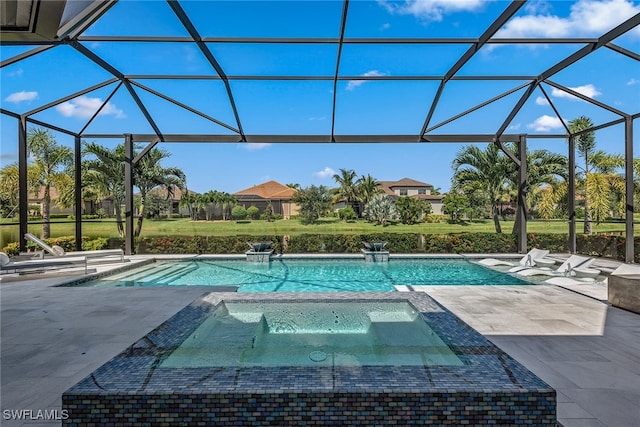 view of pool with an in ground hot tub, a lanai, and a patio area