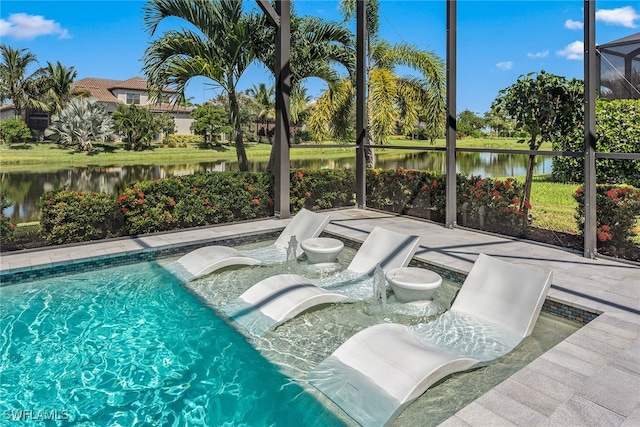 view of pool featuring a patio and a water view