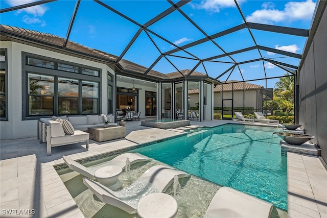 view of pool with ceiling fan, an outdoor hangout area, a lanai, and a patio area