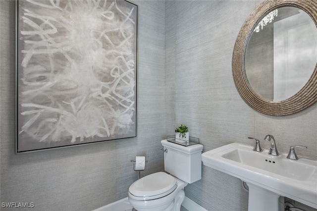 bathroom with sink and toilet