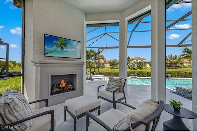 sunroom with an outdoor fireplace