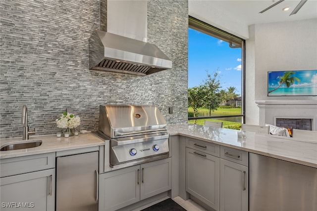 view of patio featuring area for grilling and sink