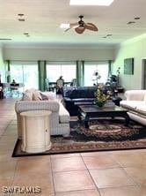 601 E Del Monte Ave, Clewiston, FL 33440 - tiled living room with a ceiling fan and ornamental molding