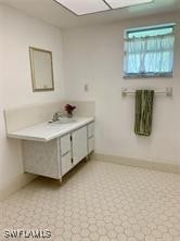 601 E Del Monte Ave, Clewiston, FL 33440 - bathroom featuring vanity and baseboards