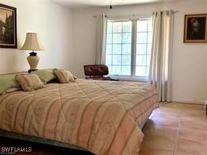 601 E Del Monte Ave, Clewiston, FL 33440 - bedroom with multiple windows and tile patterned floors