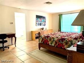 bedroom featuring tile patterned floors