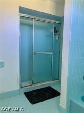 bathroom featuring walk in shower