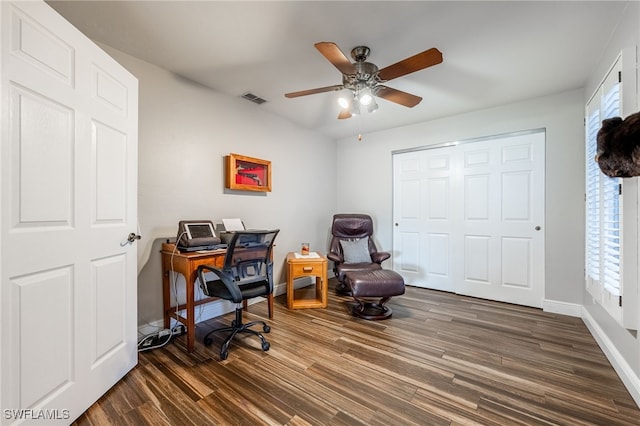 office with dark wood-type flooring, visible vents, plenty of natural light, and baseboards