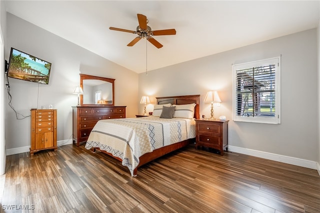 bedroom with lofted ceiling, a ceiling fan, baseboards, and dark wood-style flooring