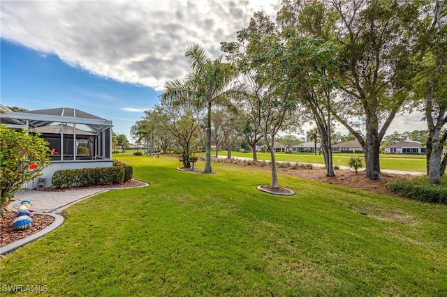 view of yard featuring a lanai