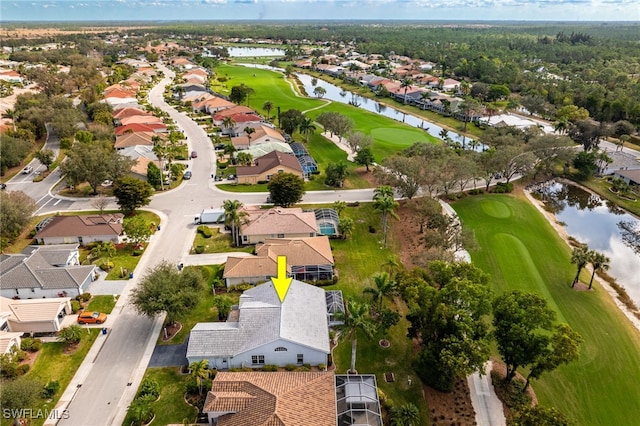 bird's eye view with a water view, a residential view, and golf course view