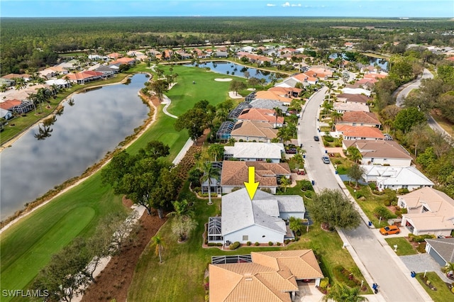 bird's eye view featuring a water view and a residential view