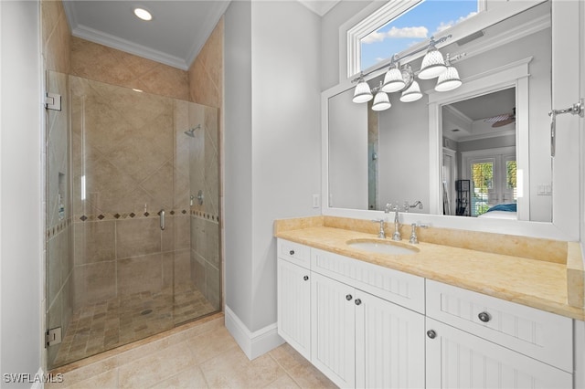 bathroom featuring tile patterned floors, vanity, an enclosed shower, and ornamental molding