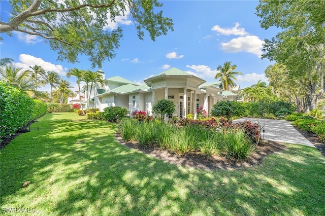 view of property exterior with a lawn