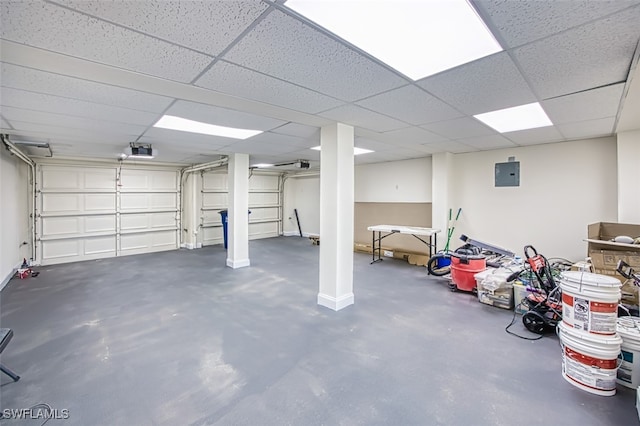 garage with electric panel and a garage door opener