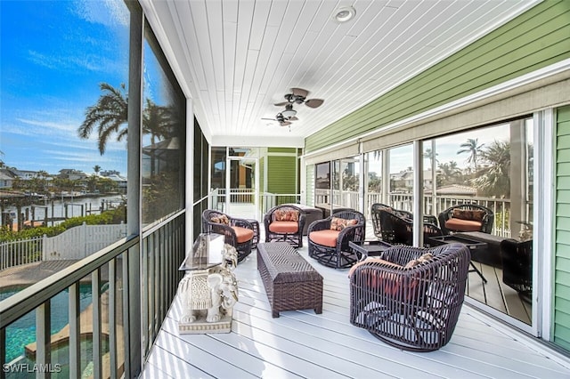 18141 Old Pelican Bay Dr, Fort Myers Beach, FL 33931 - sunroom / solarium featuring an outdoor living space and a ceiling fan