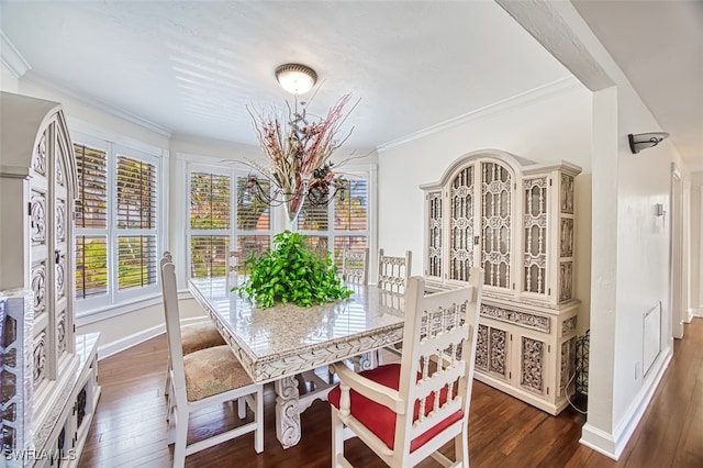 dining room with ornamental molding and dark wood-type flooring