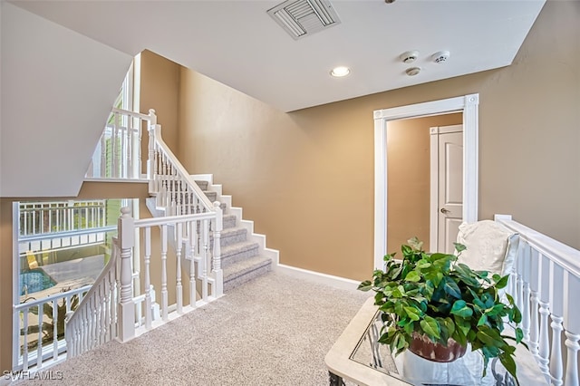 18141 Old Pelican Bay Dr, Fort Myers Beach, FL 33931 - staircase with carpet flooring and recessed lighting