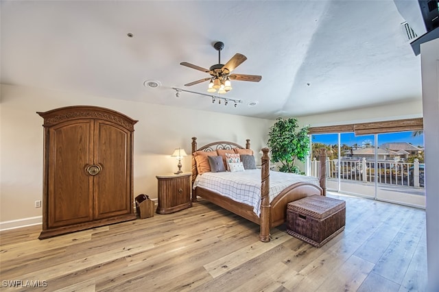 bedroom with access to outside, ceiling fan, light hardwood / wood-style floors, and vaulted ceiling