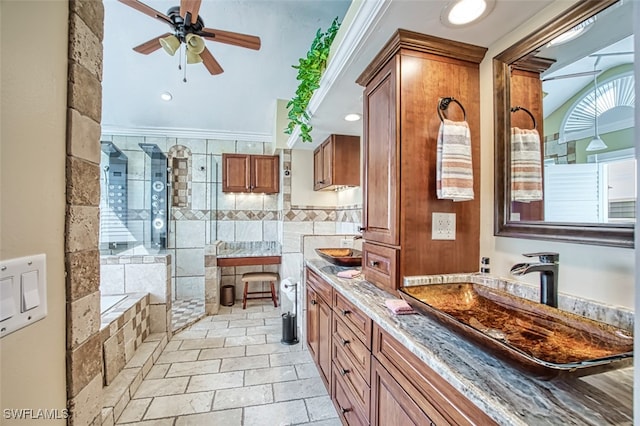 bathroom featuring vanity, ceiling fan, crown molding, and independent shower and bath