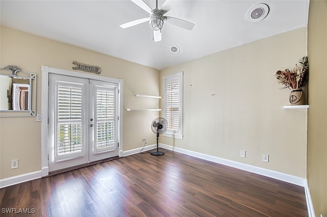 unfurnished room with dark hardwood / wood-style flooring, ceiling fan, and french doors