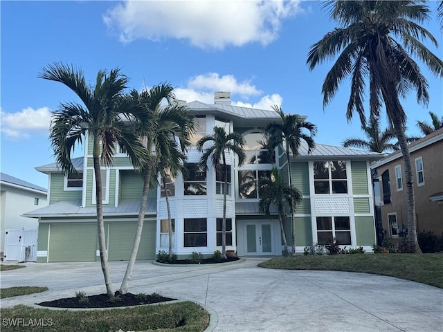 18141 Old Pelican Bay Dr, Fort Myers Beach, FL 33931 - view of property featuring a garage and concrete driveway