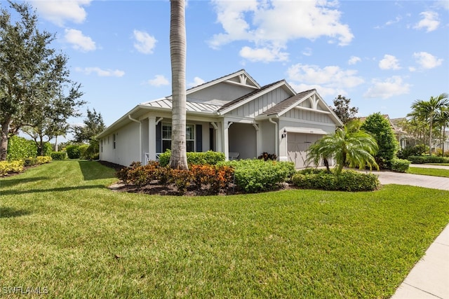 view of front facade with a garage and a front lawn