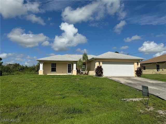 single story home featuring a garage and a front lawn