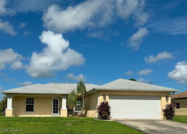 single story home featuring a front lawn, concrete driveway, an attached garage, and stucco siding