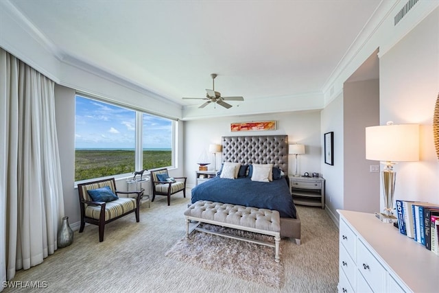 carpeted bedroom featuring ceiling fan and crown molding