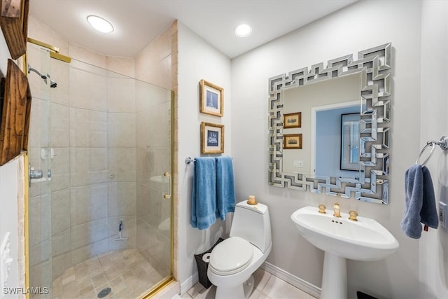 bathroom featuring tile patterned floors, toilet, and an enclosed shower