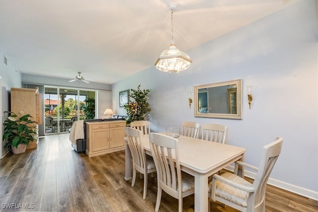 dining area with hardwood / wood-style flooring and ceiling fan