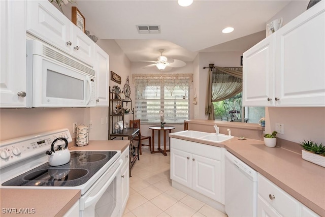 4705 Hawks Nest Way Unit 103, Naples, FL 34114 - kitchen featuring white cabinets, visible vents, a sink, and white appliances