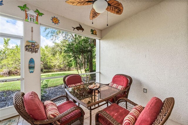 4705 Hawks Nest Way Unit 103, Naples, FL 34114 - sunroom / solarium featuring a ceiling fan and outdoor dining area