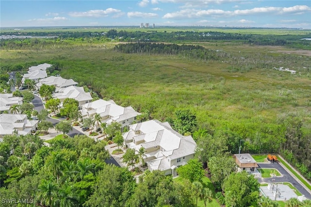 4705 Hawks Nest Way Unit 103, Naples, FL 34114 - aerial view with a wooded view and a residential view