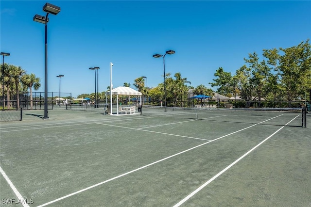 4705 Hawks Nest Way Unit 103, Naples, FL 34114 - view of tennis court featuring fence