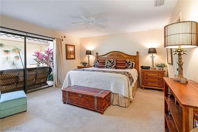 bedroom with access to exterior, a ceiling fan, visible vents, and carpet floors