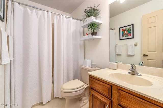 bathroom with tile patterned flooring, curtained shower, toilet, and vanity