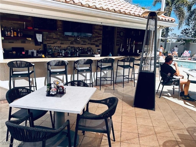 view of patio / terrace featuring outdoor dining area and outdoor dry bar