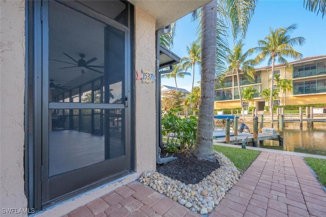 1537 Chesapeake Ave Unit A-4, Naples, FL 34102 - property entrance with stucco siding and a water view