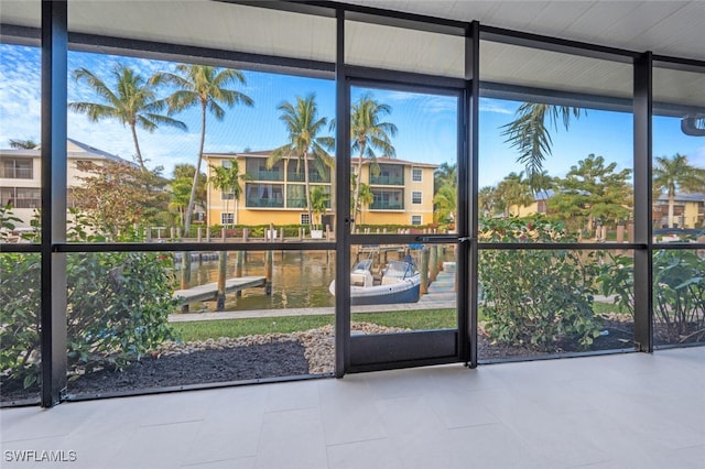 interior space featuring plenty of natural light and a water view