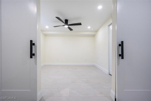 tiled empty room with ceiling fan