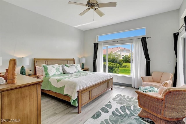 bedroom featuring light wood-type flooring and ceiling fan