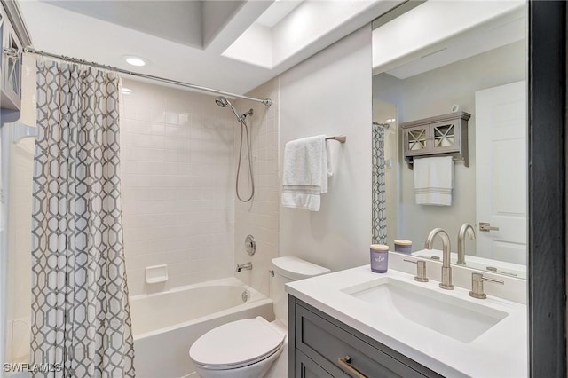 full bathroom with vanity, shower / bath combination with curtain, and toilet