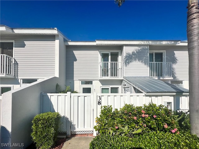 view of side of property with a balcony