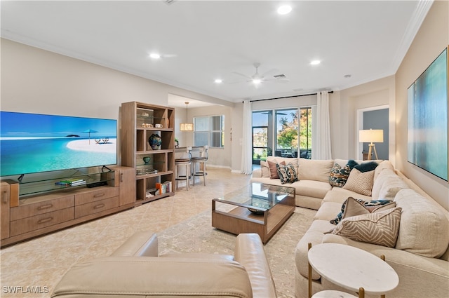 living room with crown molding and ceiling fan