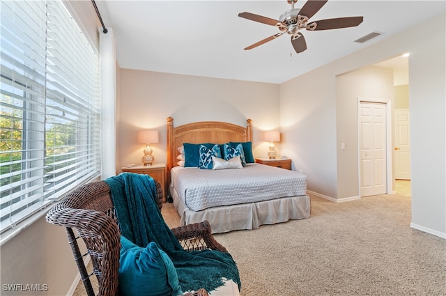 carpeted bedroom with ceiling fan